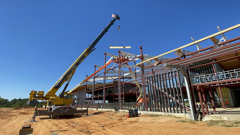 A construction crane hoists the first roof beam on Texarkana Regional Airport's new passenger terminal Thursday, Sept. 29, 2022, in Texarkana, Ark. The terminal is targeted for opening in 2024. (Submitted photo by Tyler Brown)