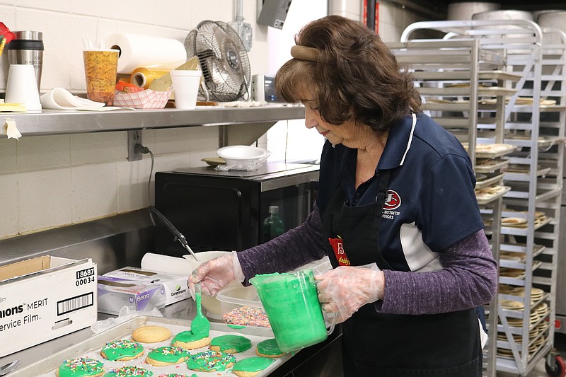 Anna Campbell/News Tribune
Betty Keown, a member of the nutrition services team at Thomas Jefferson Middle School ices sugar cookies for Central Bank for Living Windows. Keown makes all of her cookies from scratch, including the cookies she makes for students at school lunches.