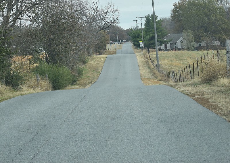 A man walks Nov. 23 along Stadium Avenue in Decatur.

(NWA Democrat-Gazette/Mike Eckels)