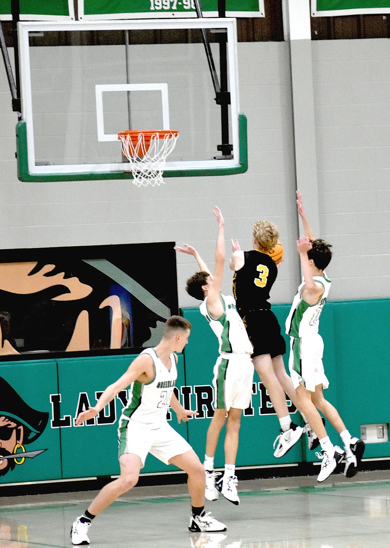 MARK HUMPHREY  ENTERPRISE-LEADER/Prairie Grove junior Eric Henderson elevates while drawing contact on a drive to the basket.