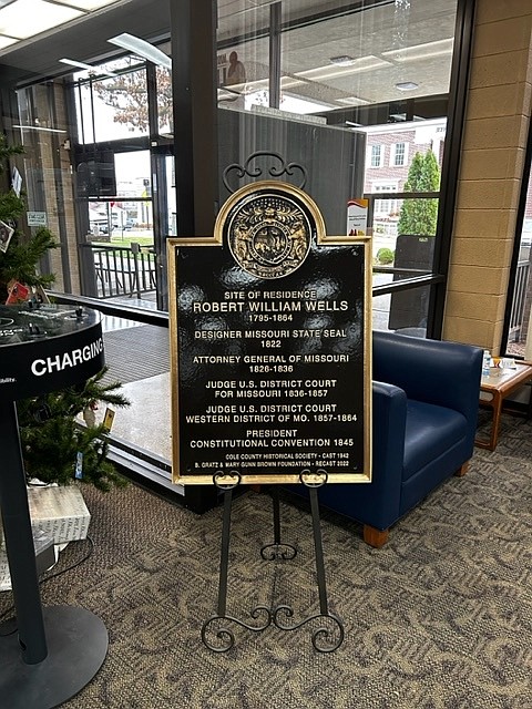 Gemma Asel/News Tribune photo: The new historical plaque honoring Judge Robert Wells is featured in the Missouri River Regional Library in Jefferson City.