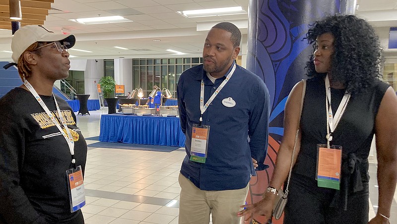 Trenay Hayes (left) a University of Arkansas at Pine Bluff student, speaks with Sherrell Wilson and LaTonya Johnson, both recruiters with Walt Disney World. (Special to The Commercial/University of Arkansas at Pine Bluff)