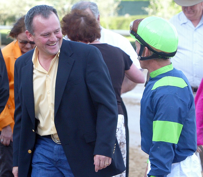 Trainer Kelly Von Hemel, left, is all smiles talking with jockey Tim Doocy after they won with Semaphore Man in the Count Fleet Sprint Handicap on April 10, 2008, at Oaklawn. - File photo by The Sentinel-Record