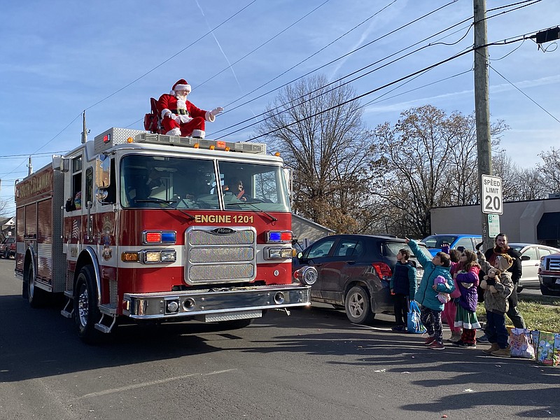 Anakin Bush/Fulton Sun
Santa rides on top of a fire truck in the Fulton Christmas Parade and waves down at children. The theme of this year's parade was "A Farmhouse Christmas," as voted on by followers of the Callaway Dreams Facebook page.