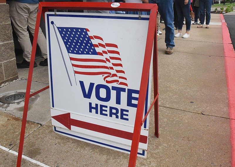 People file into the Benton County Administration building May 21 for early voting.
(File Photo/NWA Democrat-Gazette/Flip Putthoff)