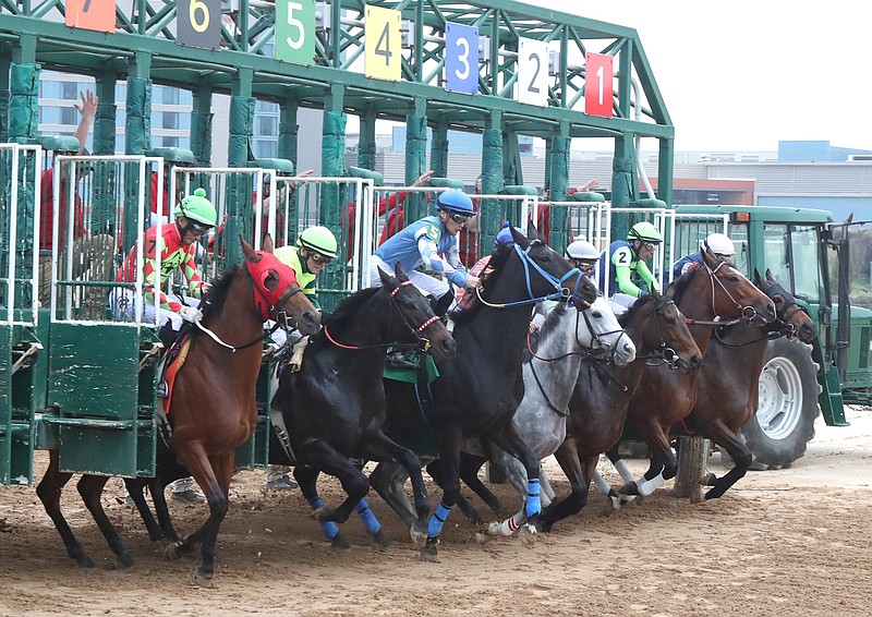 Horses break from the starting gate during the first race of Oaklawn's live race meet on December 3, 2021. Oaklawn's live race meet begins on Friday. (The Sentinel-Record/File photo)