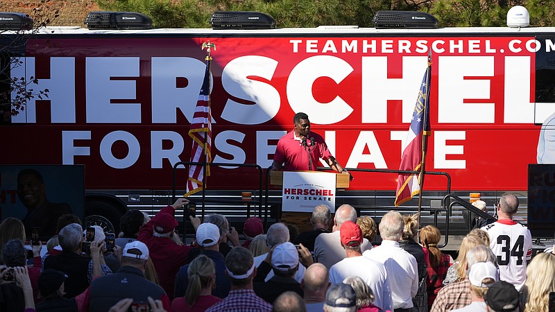 Republican candidate for U.S. Senate Herschel Walker speaks during a campaign rally Tuesday, Nov. 29, 2022, in Greensboro, Ga. Walker is in a runoff election with incumbent Democratic Sen. Raphael Warnock. (AP Photo/John Bazemore)