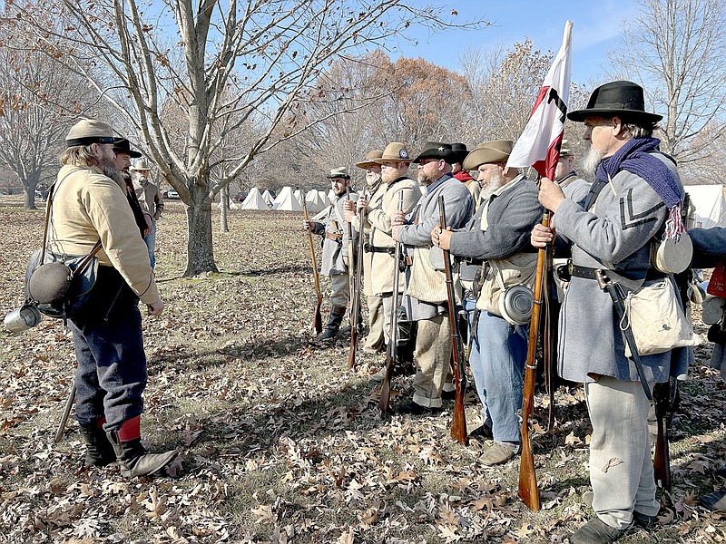 LYNN KUTTER ENTERPRISE-LEADER
Rusty Guenard, portraying Earl Fontaine of Cane Hill, commander of Company B, talks to his Confederate unit about the soldiers they are representing in the 160th anniversary of the Battle of Prairie Grove. Thousands attended the reenactment held Saturday and Sunday at Prairie Grove Battlefield State Park, and about 1,000 reenactors participated throughout the weekend.  Guenard, of Fayetteville, is with the Arkansas Confederate Guards in the Arkansas Battalion.