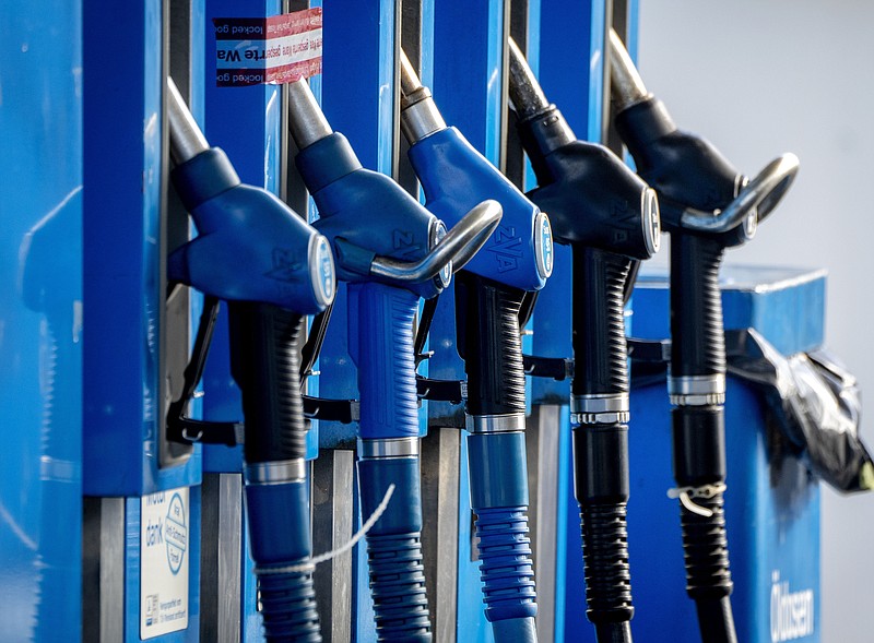 Taps are photographed at a gas station in Frankfurt, Germany, on Oct. 5, 2022. The Saudi-led OPEC oil cartel and allied producing countries, including Russia, are scheduled to decide how much oil to supply to the global economy amid weakening demand in China and uncertainty about the impact of new Western sanctions against Russia that could take significant amounts of oil off the market. (AP Photo/Michael Probst, File)