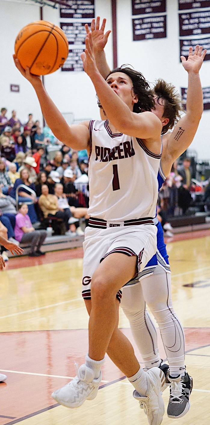 Westside Eagle Observer/RANDY MOLL
Gentry's Hayden Henry goes up for a shot from under the basket during Friday night's game against the visiting Paris Eagles.