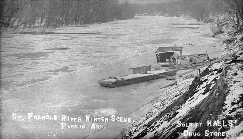 A barge and a houseboat float on the St. Francis River at Parkin (Cross County) during winter. (Courtesy of the Butler Center for Arkansas Studies, Central Arkansas Library System)