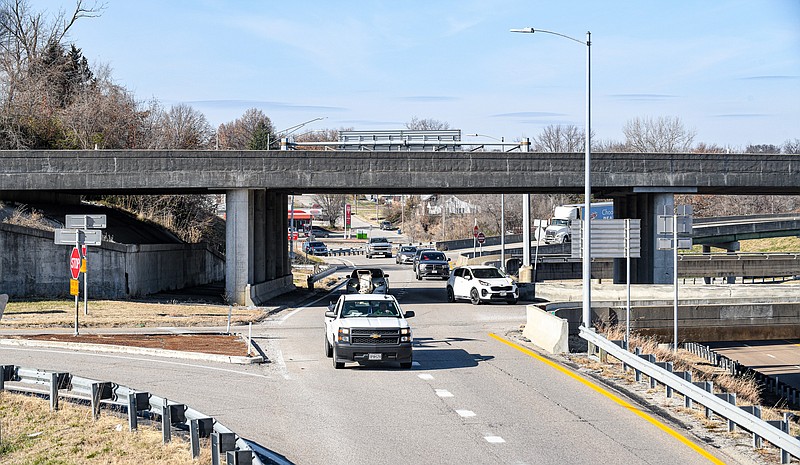 Julie Smith/News Tribune photo: 
MoDOT will close the eastbound U.S. 54/63 and US 50/63 eastbound exits at the tri-level early in the second quarter of 2023 to work on the bridge over U.S. 50. Shown here is traffic passing through the intersection Monday. During that time, drivers will not be able to exit US 50 to go northbound on US 54/63 to cross the Missouri River bridge. And motorists looking to take the US 54 exit to go westbound on US 50 will be unable to make that turn, either.