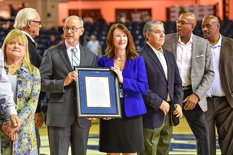 Terisa Riley (center, right), chancellor of the University of Arkansas at Fort Smith, participates in a court dedication in honor of coach Gayle Kaundart on Thursday during halftime of a men’s basketball game inside the Stubblefield Center in Fort Smith. At a meeting on Wednesday, Riley gave the UAFS Board of Visitors an update on development of the university’s strategic plan for 2023 through 2028. Visit nwaonline.com/photo for today’s photo gallery.

(River Valley Democrat-Gazette/Hank Layton)