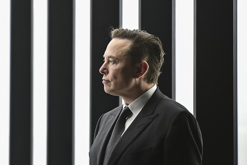 Elon Musk, Tesla CEO, attends the opening of the Tesla factory Berlin Brandenburg in Gruenheide, Germany, on March 22. Musk said during a presentation Wednesday, Dec. 1, that his Neuralink company is seeking permission to test its brain implant in people soon. Musk’s Neuralink is one of many groups working on linking brains to computers, efforts aimed at helping treat brain disorders, overcoming brain injuries and other applications. (Patrick Pleul/Pool via AP, File)
