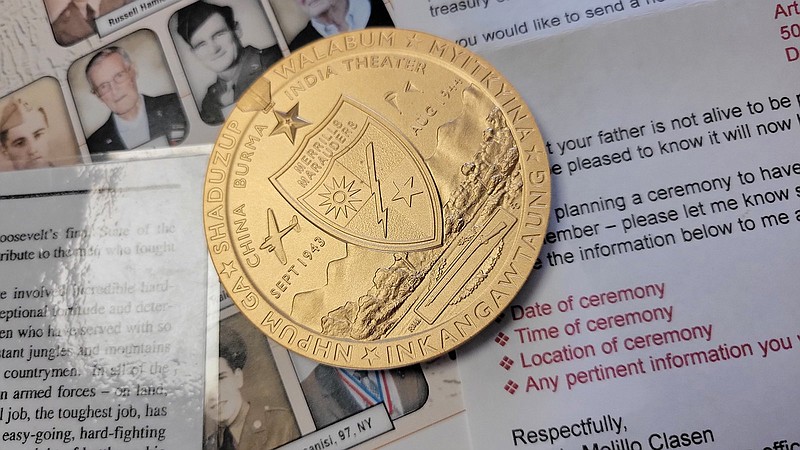 Members and families of Merrill's Marauders were given the opportunity to purchase a bronze casting of the Congressional medal honoring the soldiers.  - Photo by Lance Brownfield of The Sentinel-Record