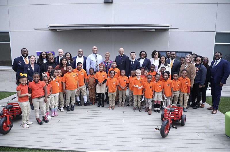 Students, faculty and administrators of Friendship Aspire Academy Downtown Campus gather for a group photo during its grand opening Tuesday. The school officially welcomed students Monday. (Special to The Commercial)