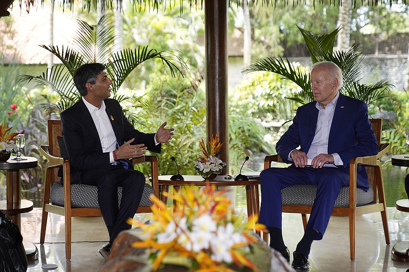FILE - U.S. President Joe Biden, right, listens to British Prime Minister Rishi Sunak during a meeting on the sidelines of the G20 summit meeting, Nov. 16, 2022, in Nusa Dua, Bali, Indonesia. In his first month as Britain's prime minister, Sunak has stabilized the economy, reassured allies from Washington to Kyiv and even soothed the European Union after years of sparring between Britain and the bloc. But Sunak’s challenges are just beginning. He is facing a stagnating economy, a cost-of-living crisis – and a Conservative Party that is fractious and increasingly unpopular after 12 years in power. (AP Photo/Alex Brandon, File)