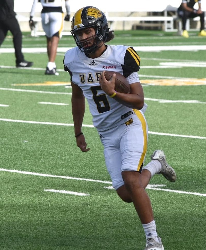 UAPB quarterback Chancellor Edwards runs a drill before a Nov. 24 win at Alabama State University in Montgomery. (Pine Bluff Commercial/I.C. Murrell)