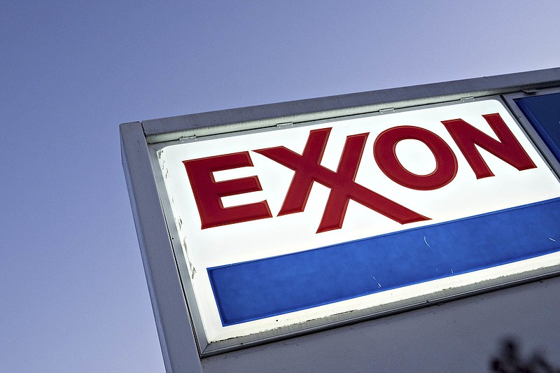 Signage is displayed at an Exxon Mobil gas station in Arlington, Virginia, on April 29, 2020. MUST CREDIT: Bloomberg photo by Andrew Harrer