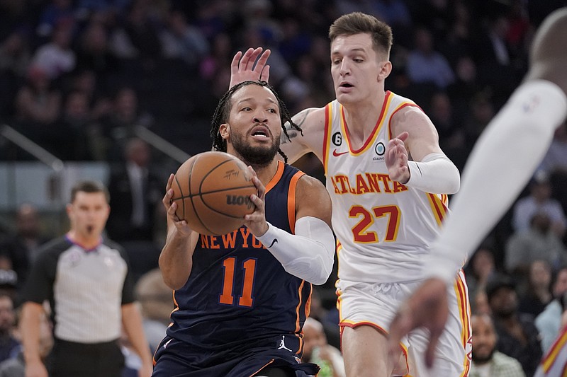 New York Knicks' Jalen Brunson (11) looks to move the ball around Atlanta Hawks guard Vit Krejci (27) during the second half of an NBA basketball game Wednesday, Dec. 7, 2022, at Madison Square Garden in New York. (AP Photo/Mary Altaffer)