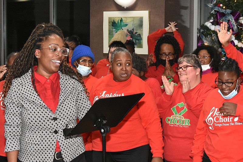 Angelica Holt, director of the Jenkins Choir, gives parting words as the choir wishes visitors of Jefferson Regional Medical Center's Christmas tree lighting "Merry Christmas!" (Pine Bluff Commercial/I.C. Murrell)