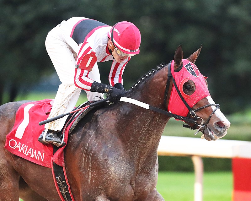 Flash of Mischief, under Cristian Torres, wins the $150,000 Ring the Bell Stakes for 3-year-olds and up at Oaklawn Friday. - Photo courtesy of Coady Photography