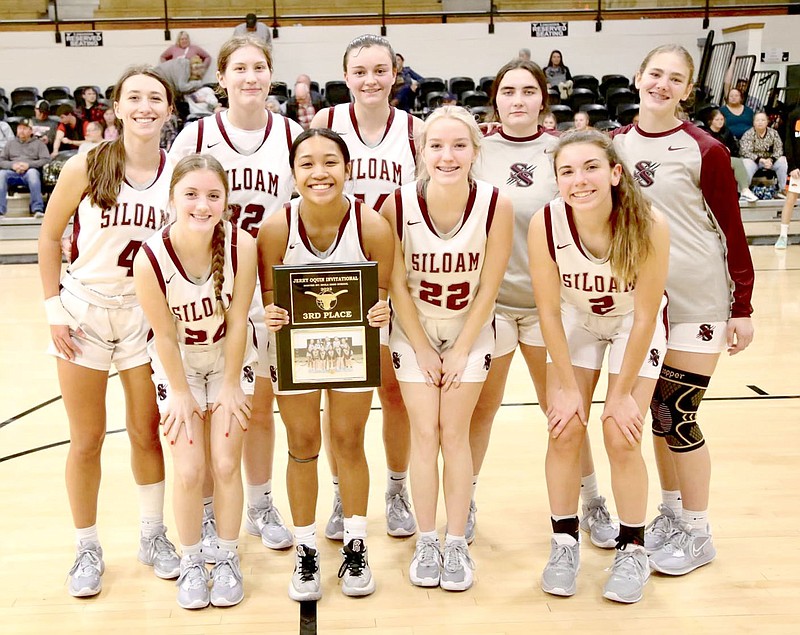 Mark Ross/Special to the Herald-Leader
The Siloam Springs girls basketball team poses for a photo with the third place plaque after defeating Fort Gibson on Saturday, Dec. 9, in the Jerry Oquin Invitational in Inola, Okla.