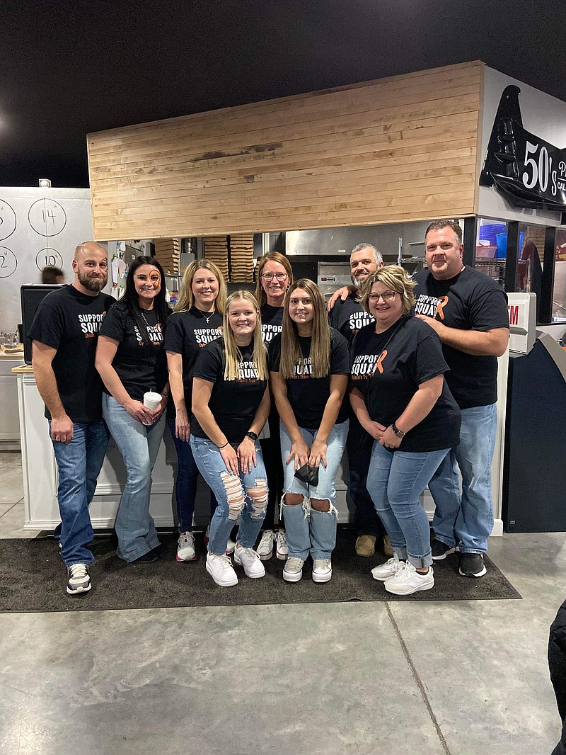 Submitted photo:  
Dylann Henley, center right, is surrounded by her friends and family as they work the 50's Pizza and Pub benefit in honor. Proceeds from the event go to her treatment for t-cell acute lymphoblastic leukemia.