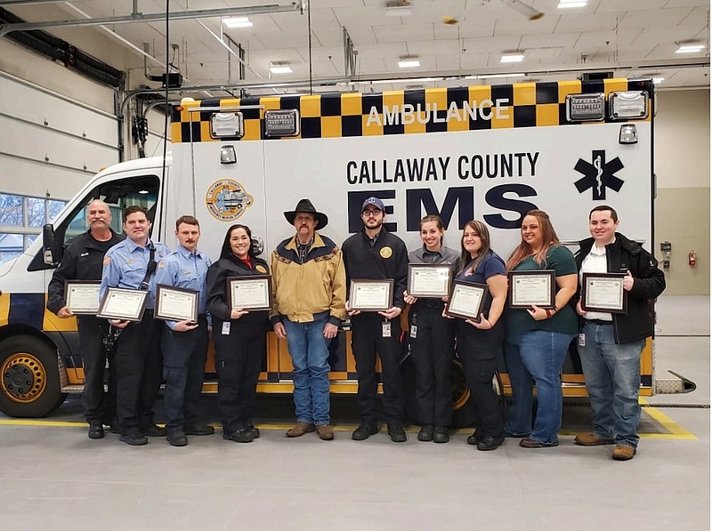 Submitted photo: 
Emergency responders from Callaway County Joint Communications, Central
Fire Protection District, Fulton Fire Department, and Callaway EMS are pictured with John Johnson, who they resuscitated after he suffered a cardiac arrest. The team effort of the agencies involved and the care from the hospital team allowed Mr. Johnson to rejoin his family and continue his living his life.