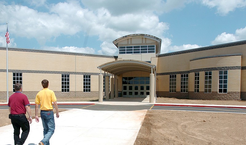 Visitors walk to the front entrance of Prairie Grove High School. 
(File Photo/NWA Democrat-Gazette)