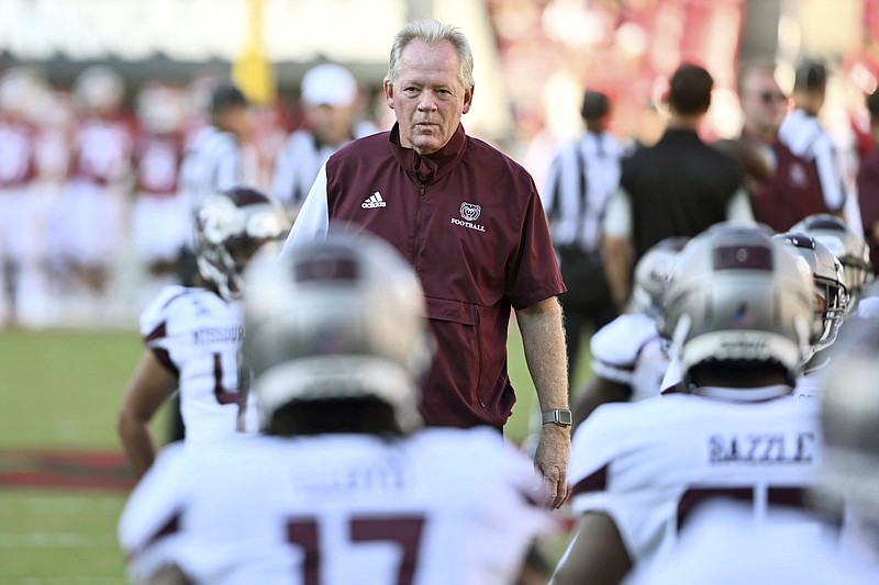 Missouri State coach Bobby Petrino watches his team warm up before playing Arkansas Sept. 17 in Fayetteville. Petrino, known for his high-powered offenses and messy departures, will be UNLV's new offensive coordinator, according to a source with knowledge of the impending hire. - Photo by Michael Woods of The Associated Press