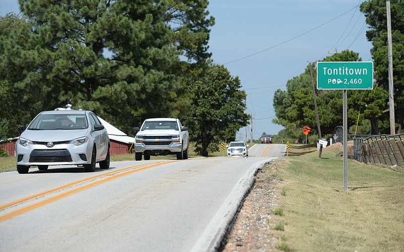 Traffic passes Sept. 24, 2021, along Arkansas 112 in Tontitown.
(File Photo/NWA Democrat-Gazette/Andy Shupe)