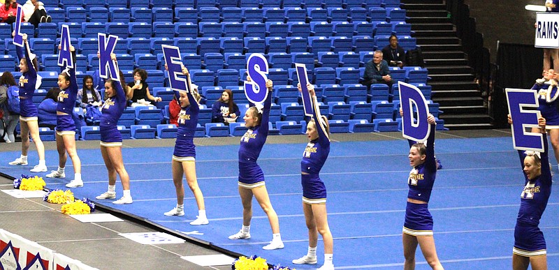 Lakeside cheerleaders spell the name of the school using signs during their performance in the state cheer championships at the Hot Springs Convention Center on Friday. - Photo by Lance Porter of The Sentinel-Record