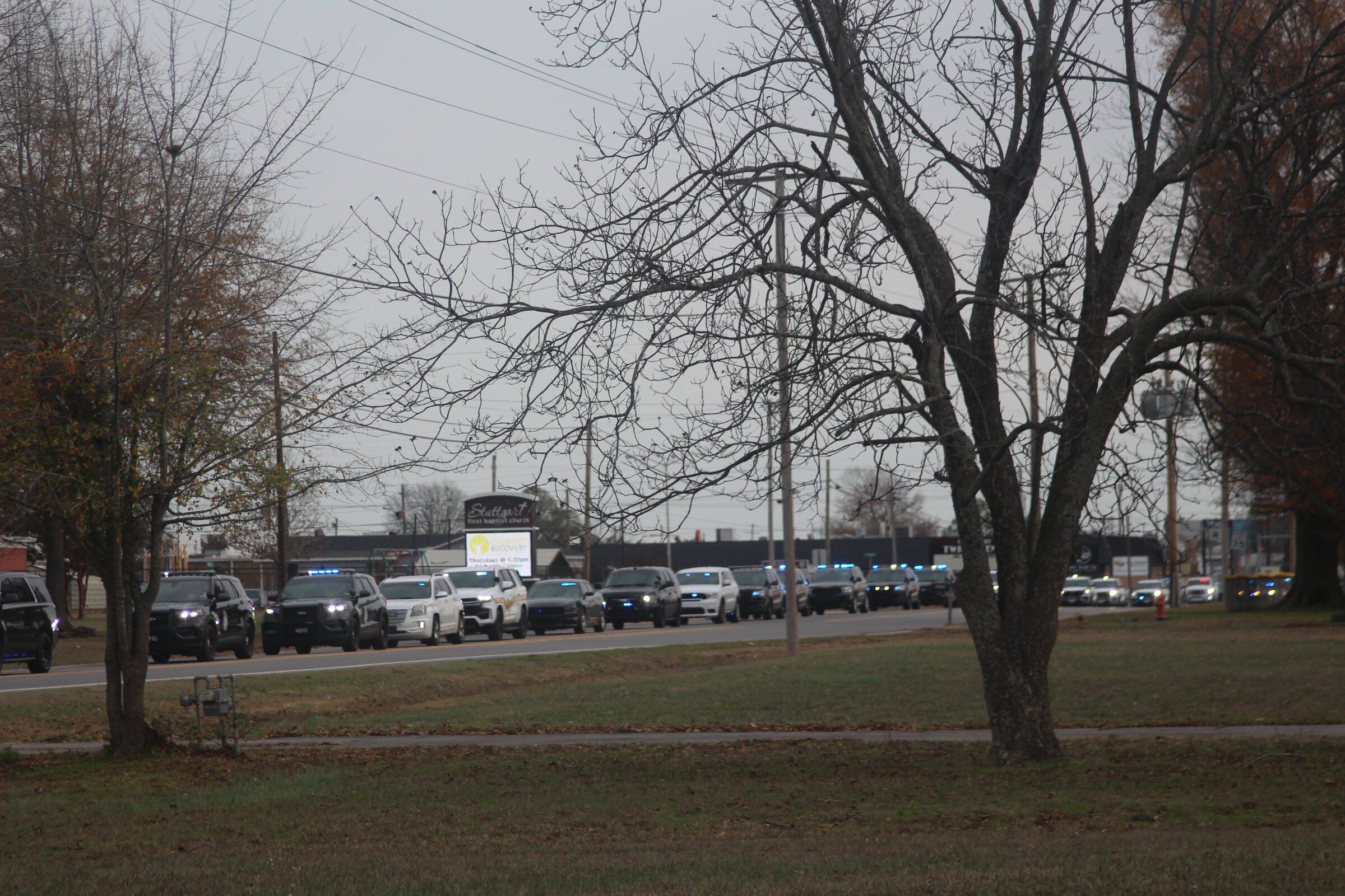Police officers escort fallen comrade home
