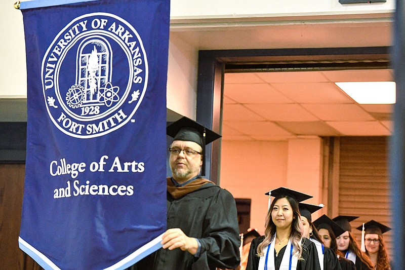 Students and faculty at the University of Arkansas-Fort Smith participate in commencement, Saturday, Dec. 17, 2022, at the Stubblefield Center on the UAFS campus in Fort Smith. More than 600 students graduated during the universityâ€™s 107th commencement, which consisted of two ceremonies, beginning with the College of Arts and Sciences in the morning followed by the College of Business and Industry and the College of Health, Education and Human Sciences in the afternoon. Visit nwaonline.com/photo for today's photo gallery.
(NWA Democrat-Gazette/Hank Layton)