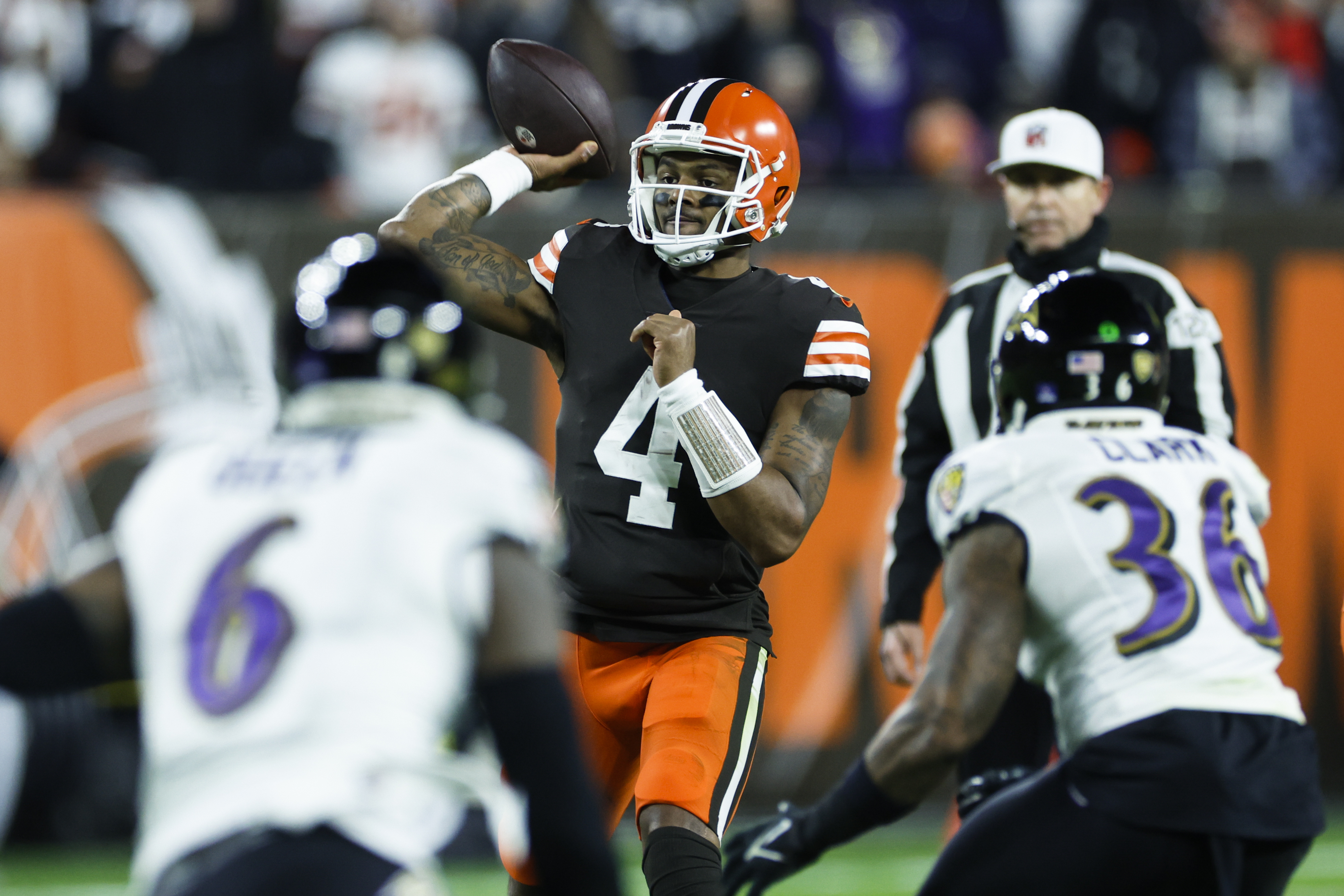 BALTIMORE, MD - OCTOBER 23: Baltimore Ravens quarterback Lamar Jackson (8)  moves to avoid Cleveland Browns defensive end Myles Garrett (95) during the Cleveland  Browns game versus the Baltimore Ravens on October