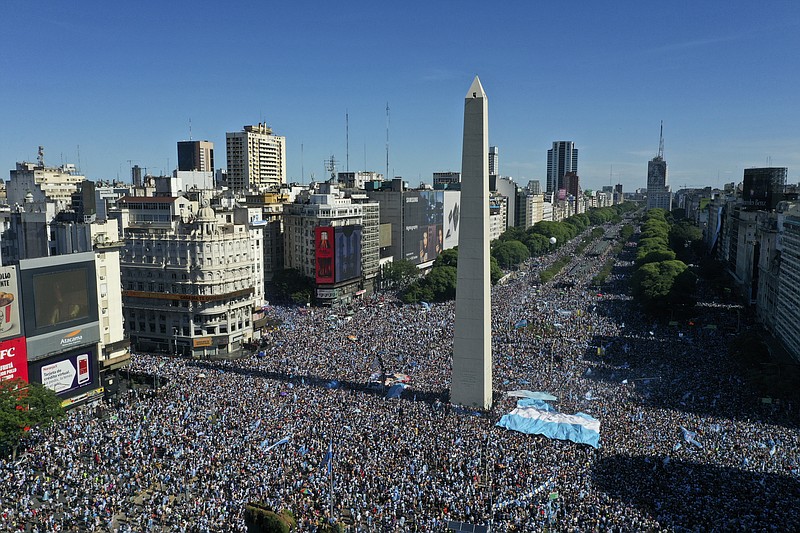 Argentine soccer fans celebrate their team's World Cup victory over France  in Buenos Aires, Argentina, Sunday, Dec. 18, 2022. (AP Photo/Gustavo Garello)