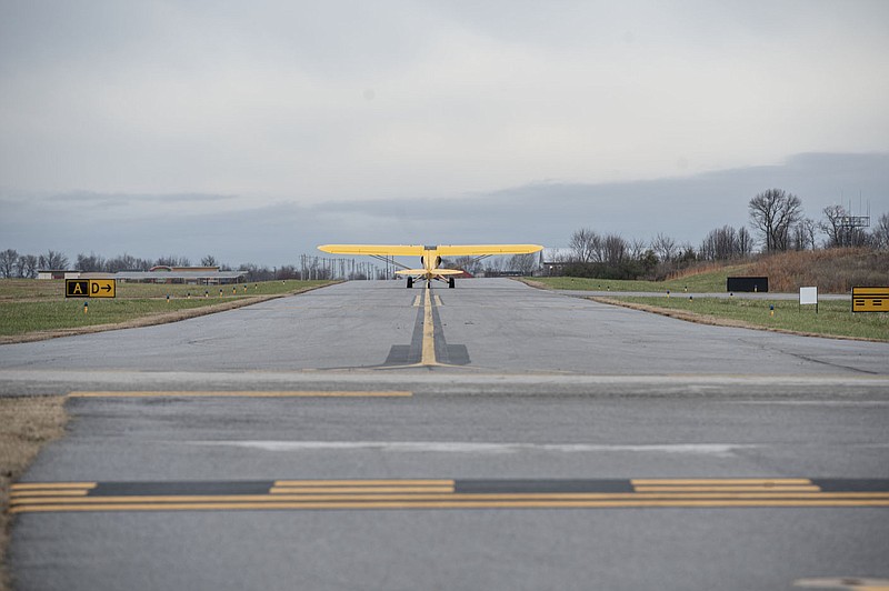 A plane taxis on the taxiway at Bentonville Municipal Airport. (NWA Democrat-Gazette/Spencer Tirey)