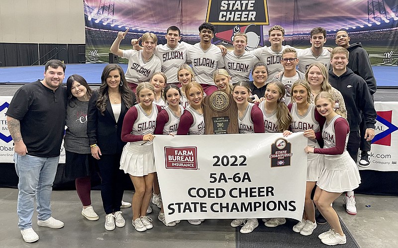 Marie Lee/Special to the Herald-Leader
Members of the Siloam Springs High School cheer team celebrate after winning the 2022 co-ed cheer state championship on Friday, Dec. 16, in Hot Springs.