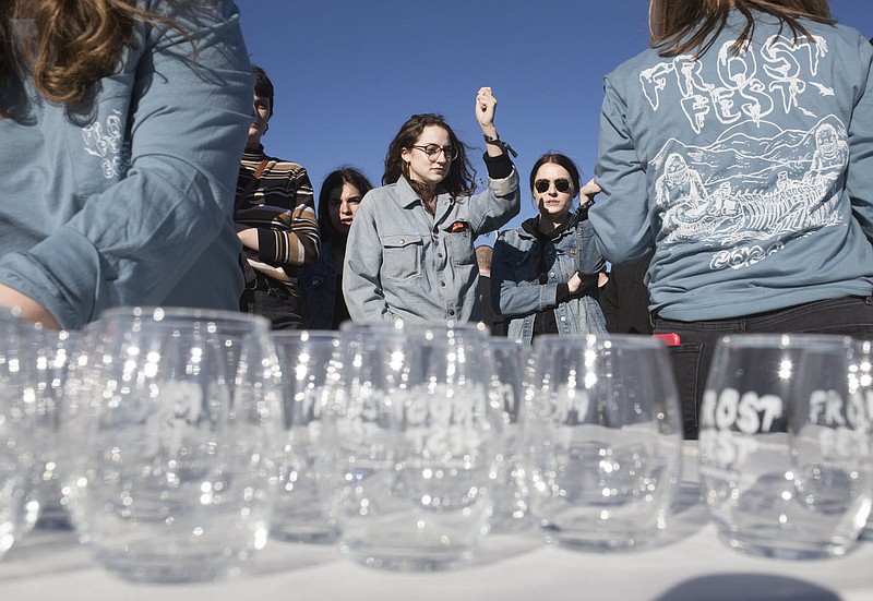 Attendees gather to grab their drinking glasses, Saturday, February 1, 2020 at Frost Fest 2020, in Fayetteville. Check out nwaonline.com/200202Daily/ for todayÕs photo gallery.
(NWA Democrat-Gazette/Charlie Kaijo)

Frost Fest is a celebration of craft beer, community and winter in the Ozarks. Frost Fest featured over 50 breweries from within a days drive of Fayetteville including breweries not distributed in Arkansas. Breweries had representatives onsite pouring samples and discussing their product and brewery. Attendees enjoyed craft beer, live music, live art, vendors and food trucks.