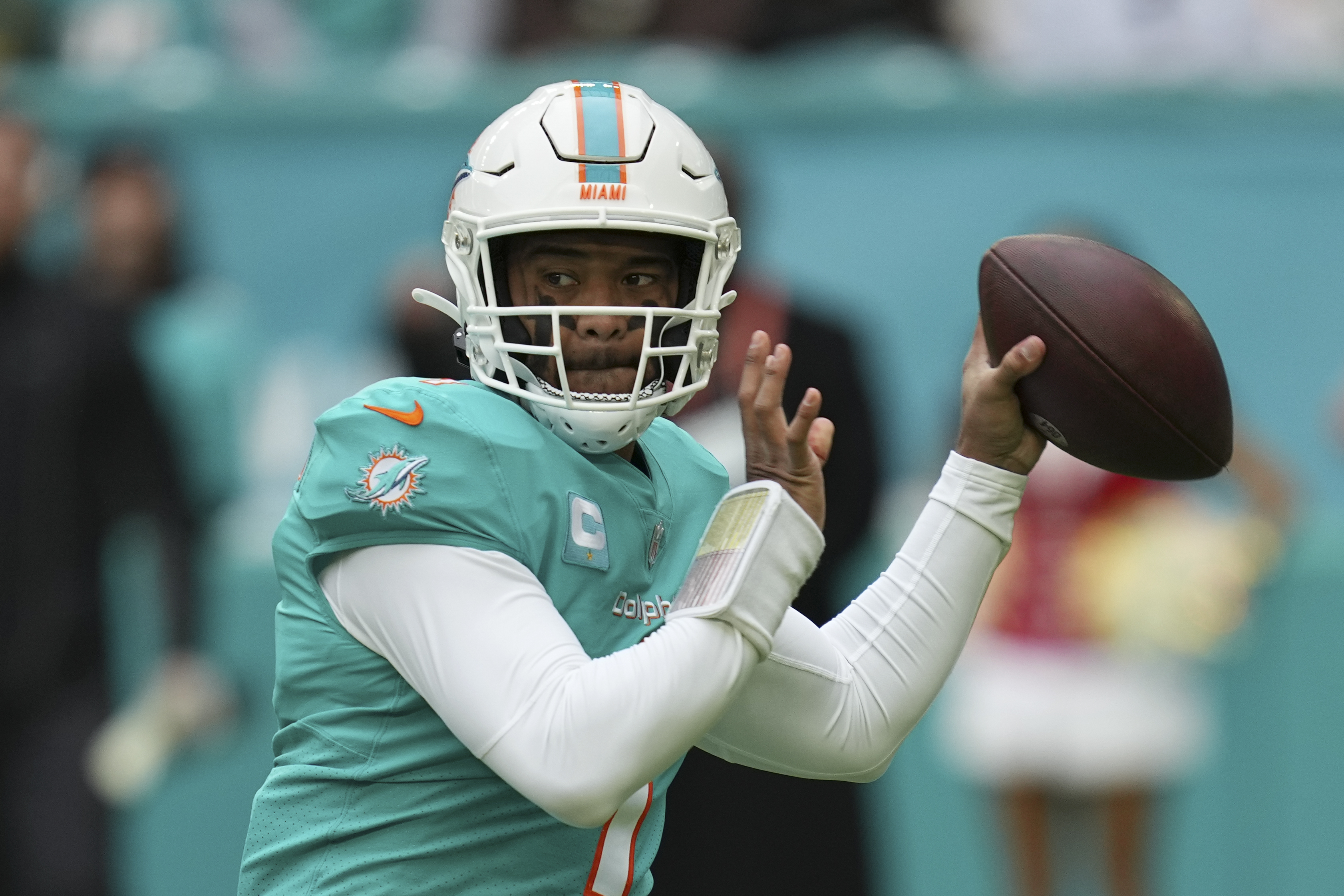 Rodgers signs ball intercepted by Dolphins' Kohou