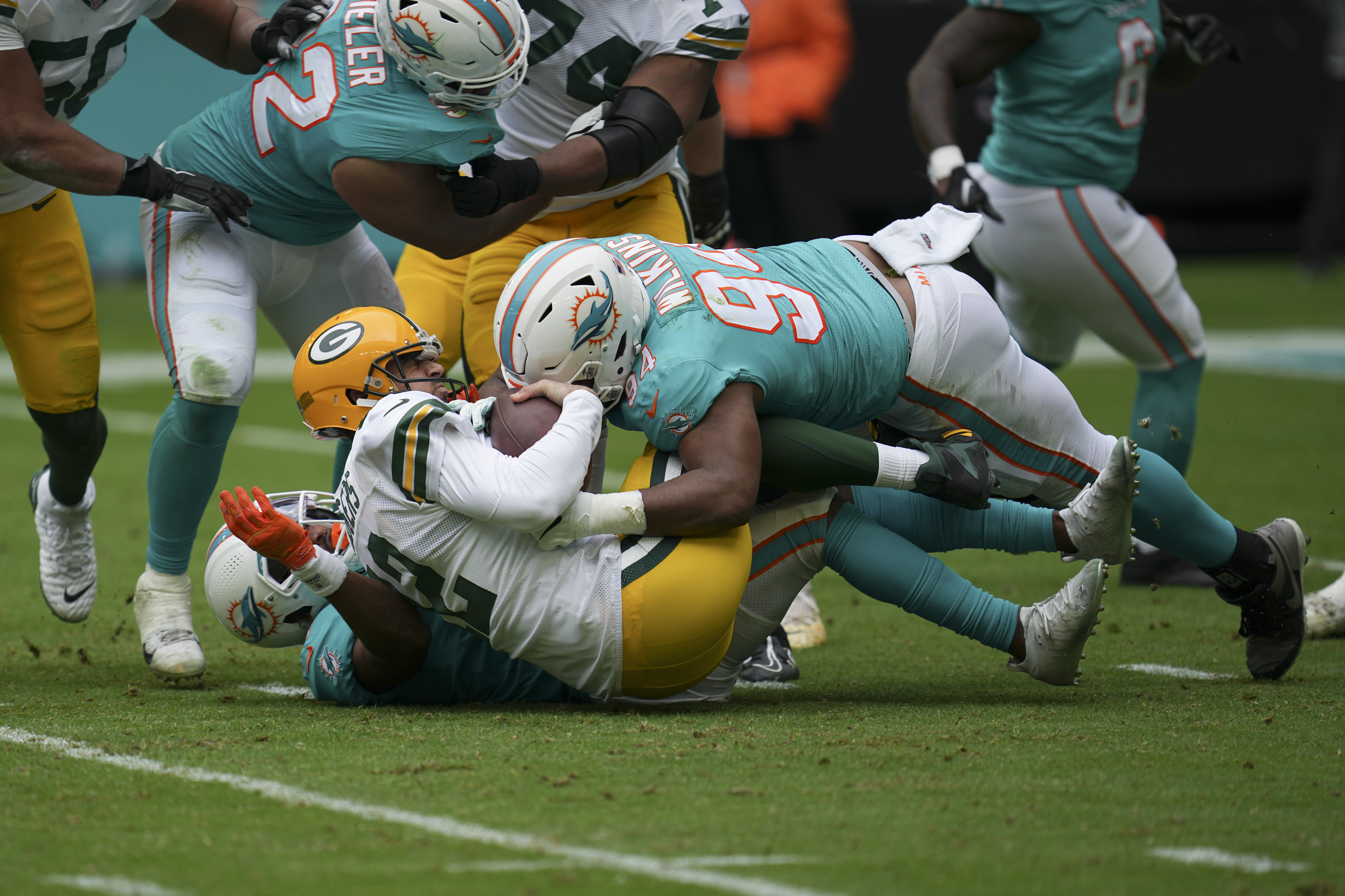 Rodgers signs ball intercepted by Dolphins' Kohou