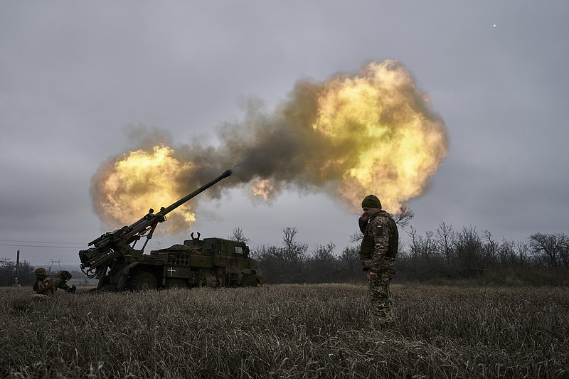 Ukrainian soldiers fire a French-made CAESAR self-propelled howitzer toward Russian positions Monday, Dec. 26, 2022, near Avdiivka, Donetsk region, Ukraine. (AP Photo/Libkos)