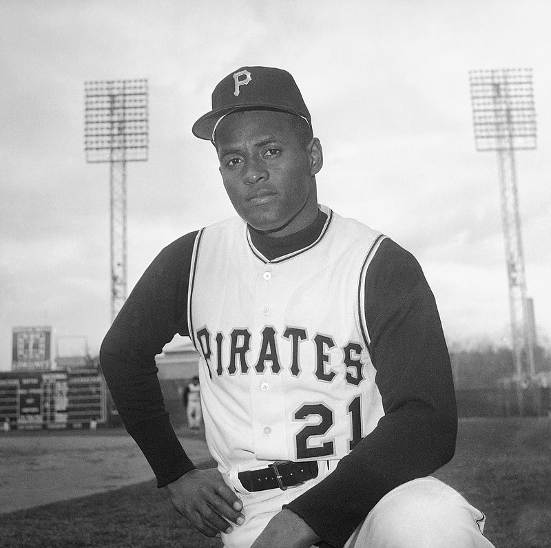 FILE - Roberto Clemente of the Pittsburgh Pirates is seen in Tampa, Fla., March 3, 1963. Fifty years after his death,  Clemente, the skillful outfielder, remains one of the most revered figures in Puerto Rico and Latin America. His graceful flare and powerful arm were unrivaled in his era, but his humanitarian efforts are perhaps his greatest legacy. Half a century after he played, many of today’s Latino baseball players credit him for paving the way. (AP Photo/Preston Stroup, File)