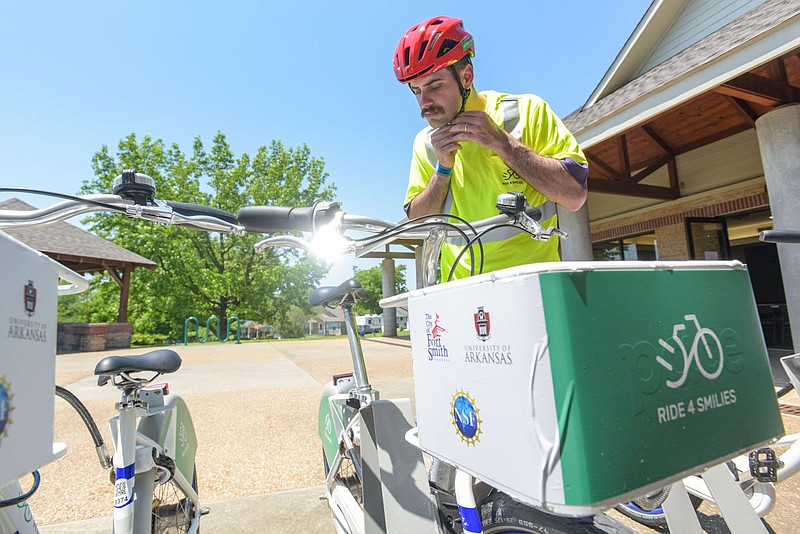 Michael Mings, mobility coordinator for the City of Fort Smith, readies to ride on May 12 at a launch and workshop for RIDE 4 SMILIES at the Elm Grove Community Center in Fort Smith. Visit nwaonline.com/photo for today's photo gallery.
(NWA Democrat-Gazette/Hank Layton)