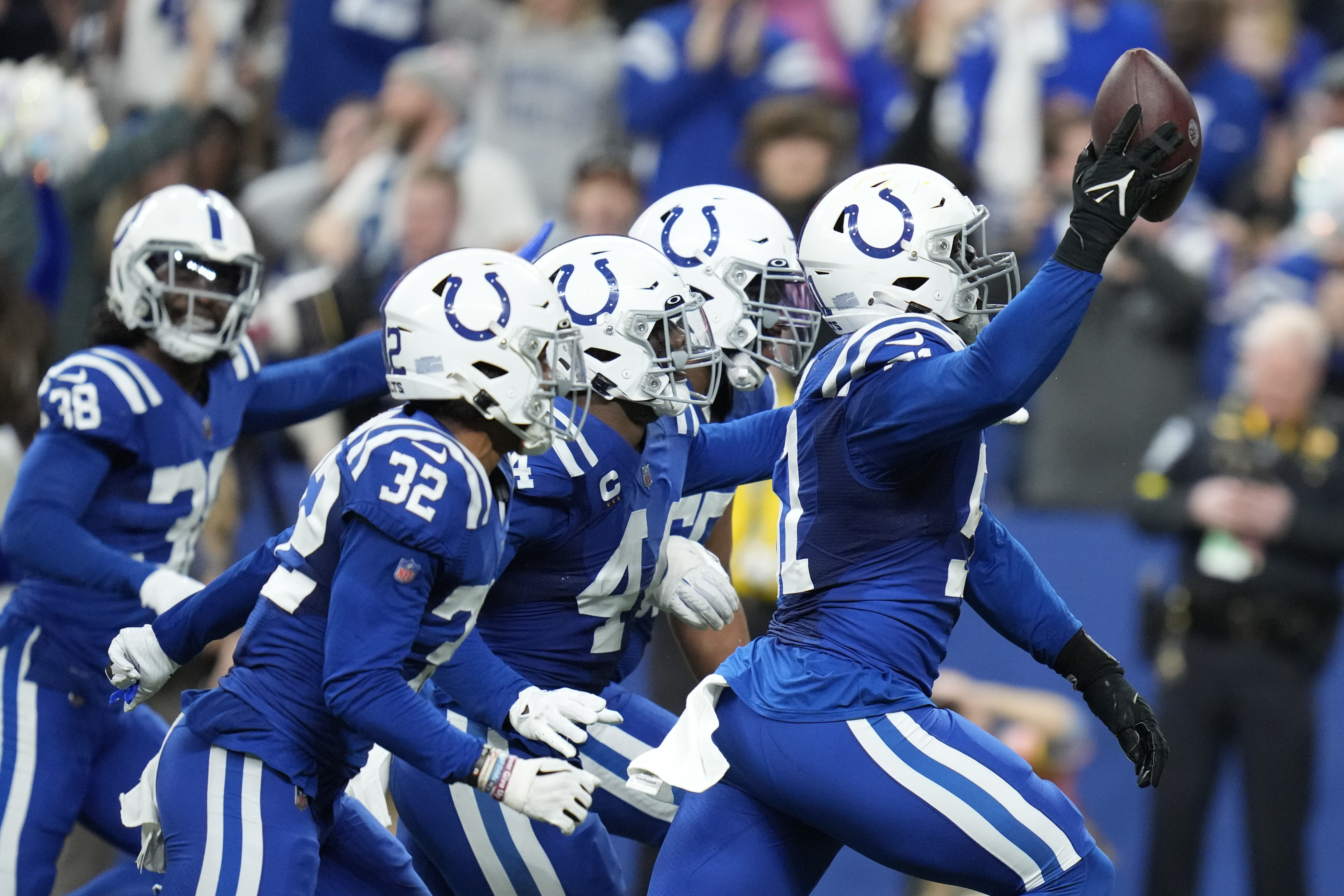 Chargers throttle past Colts in playoff-clinching victory