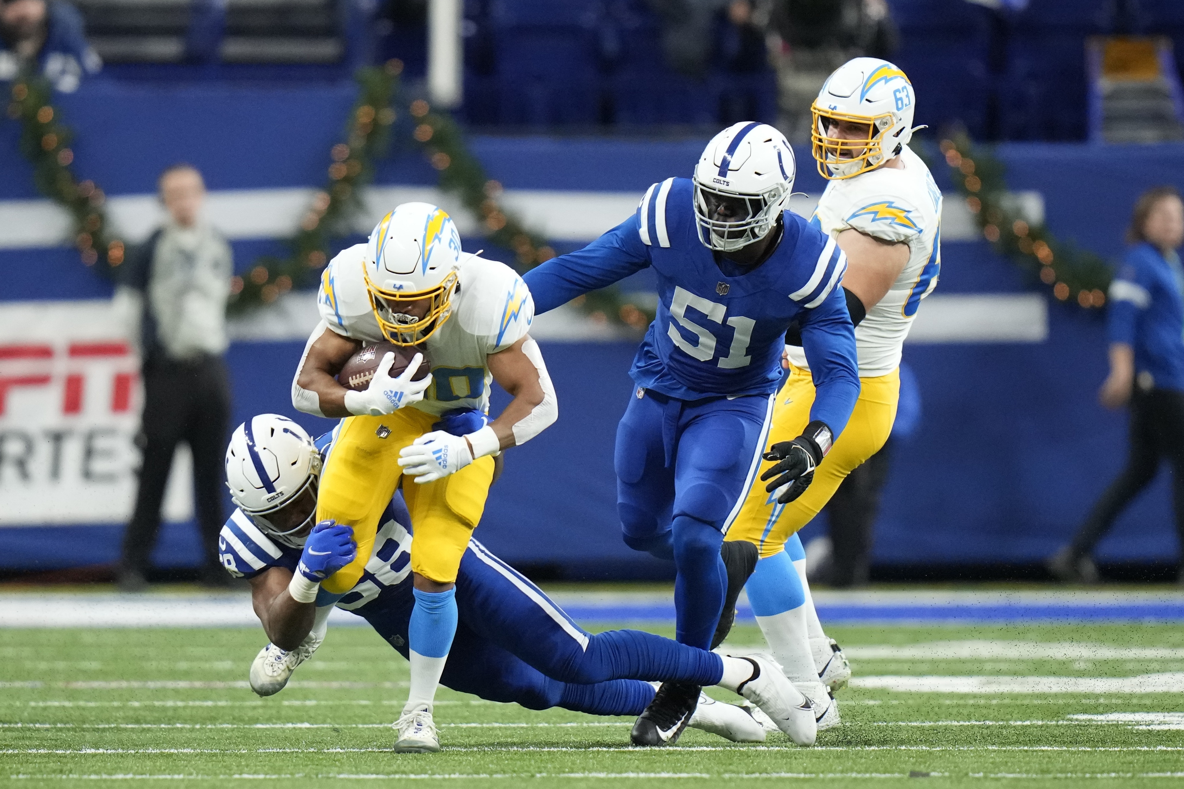 Chargers throttle past Colts in playoff-clinching victory