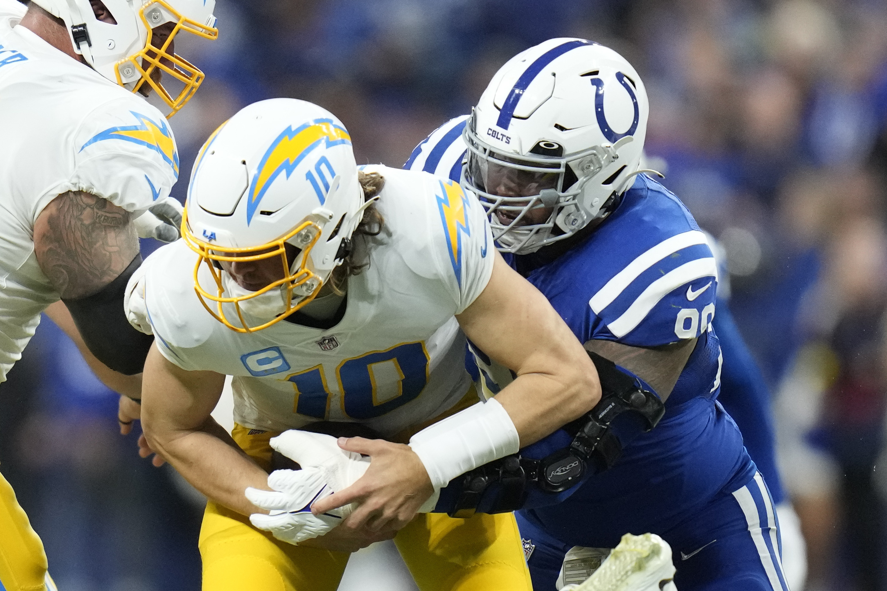 Chargers throttle past Colts in playoff-clinching victory