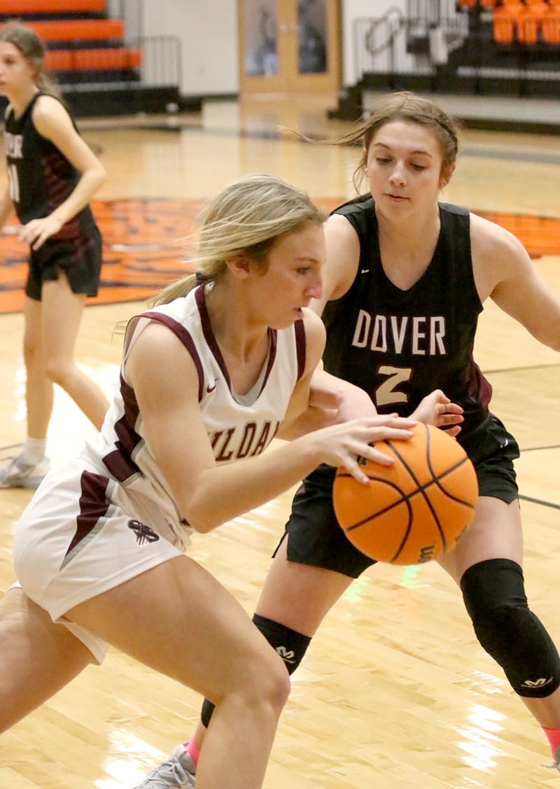 Mark Ross/Special to the Herald-Leader
Siloam Springs senior Cailee Johnson dribbles by Dover's Emerie Housley during the Lady Panthers' opening game of the Gravette Christmas Tournament on Tuesday, Dec. 27, at Lion Arena.