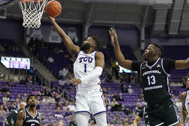 TCU guard Mike Miles Jr. (1) shoots against Central Arkansas guard Eddy Kayouloud (13) during the first half of an NCAA college basketball game in Fort Worth, Texas, Wednesday, Dec. 28, 2022. (AP Photo/LM Otero)